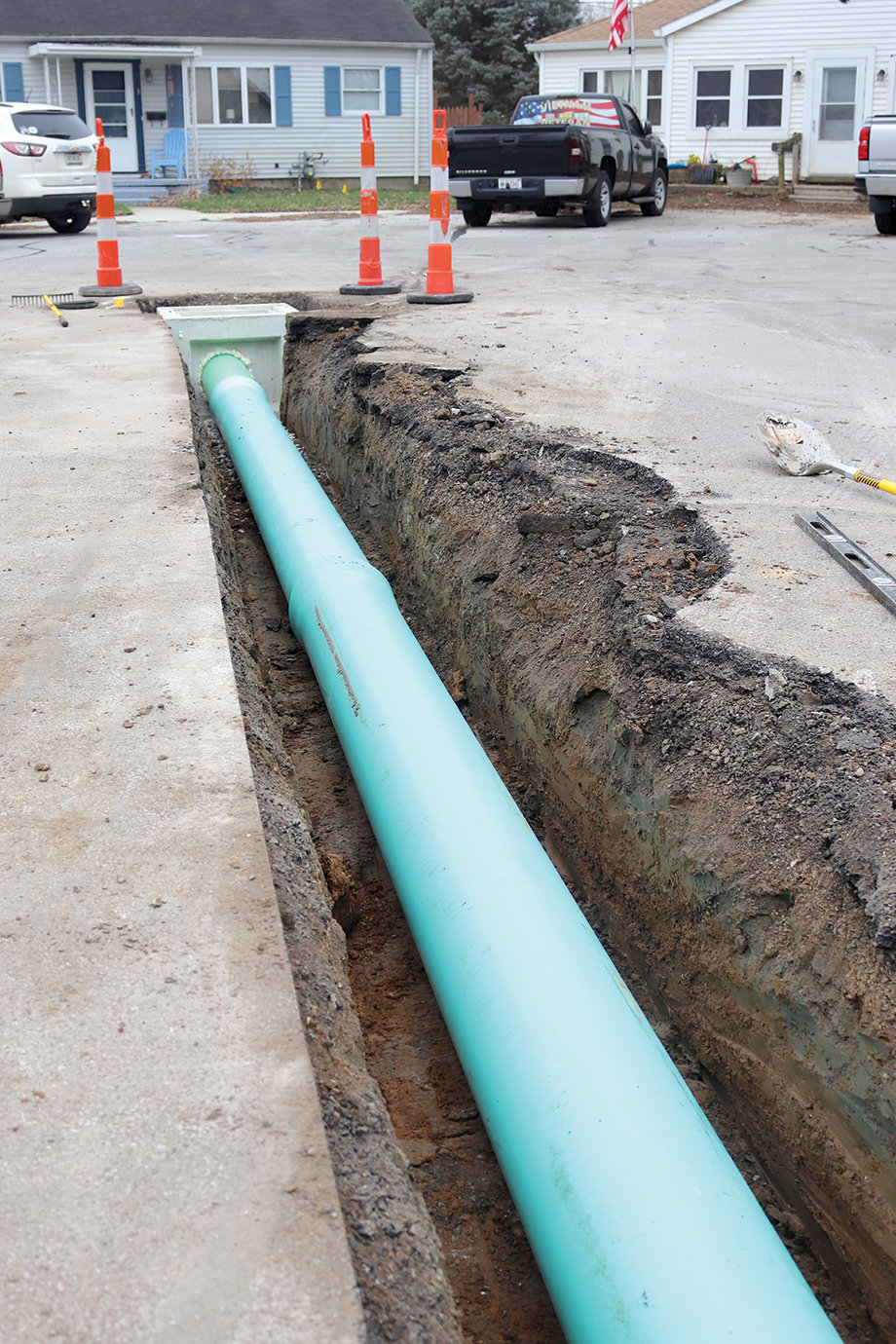 A newly installed drainage pipe reaches the center of the Circle Drive cul de sac from West Market Street.